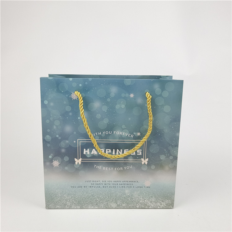 Bestseller Umweltschutzfreundliches Recycling-Logo gedruckte Einkaufspapierbeutel Verpackung Weiß 110 Gramm Wiederverwendbar