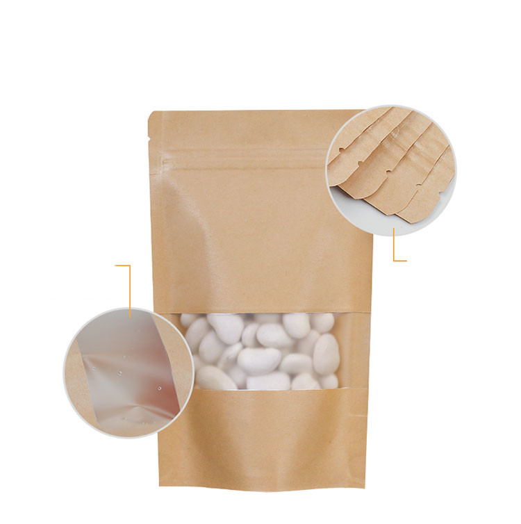 Der biologisch abbaubare Brown-Kraftpapier-Reißverschluss stehen oben Beutel mit Fenster